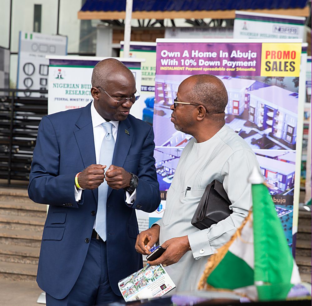 Hon Minister of Power Works  Housing Mr Babatunde Fashola SANleft and former Director General Bureau of Public Procurement Engr Emeka Ezehright shortly after  the Opening Ceremony of the 11th Abuja Housing Show on the theme Solving Nigerias Housing Challenge through Innovative Finance and Infrastructure Solutions organized by Fesadeb Media Group at the International  Conference Centre Abuja on Monday 17th July 2017