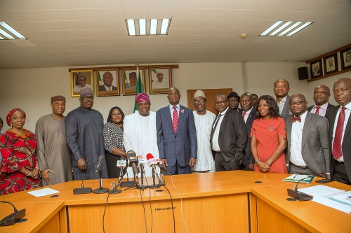 Hon Minister of Power Works  Housing Mr Babatunde FasholaSAN6th left  Minister of State HonMustapha Baba Shehuri3rd  leftGovernor of Lagos State Mr Akinwunmi Ambode5th leftSecretary to the Lagos State Government Mr Tunji Bello 2nd left Director Finance and Accounts of the MinistryMr Ibrahim Tumsah4th right Director Human Resources Mrs Motunrayo Alimileft Director Legal Services Mrs Justina Shuwa 4th left Lagos State Commissioner for Information and StrategyMr Steve Ayorinde 5th right and others  in a group photograph shortly after the Formal Handing Over of the Presidential Lodge Marina Lagos to the Government of Lagos State at the Ministry of Power Works  Housing Headquarters Mabushi Abuja on Tuesday 12th December 2017