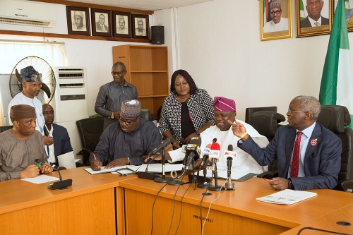 Hon Minister of Power Works  Housing Mr Babatunde FasholaSANrightMinister of State HonMustapha Baba Shehuri2nd left Governor of Lagos State Mr Akinwunmi Ambode2nd right and Secretary to the Lagos State Government Mr Tunji Bello left during the Formal Handing Over of the Presidential Lodge Marina Lagos to the Government of Lagos State at the Ministry of Power Works  Housing Headquarters Mabushi Abuja on Tuesday 12th December 2017