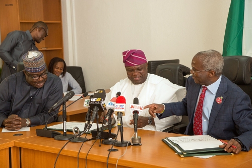 Hon Minister of Power Works  Housing Mr Babatunde FasholaSANrightMinister of State HonMustapha Baba Shehurileft and Governor of Lagos Mr Akinwunmi Ambodemiddle during the Formal Handing Over of the Presidential Lodge Marina Lagos to the Government of Lagos State at the Ministry of Power Works  Housing Headquarters Mabushi Abuja on Tuesday 12th December 2017