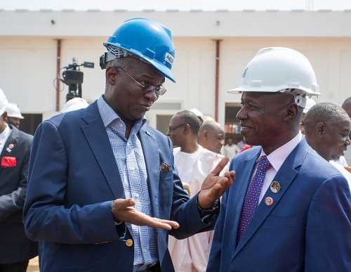 Hon Minister of Power Works  Housing Mr Babatunde FasholaSANleftandPrincipal Partner Ericon Bello  Associates Arc Ibrahim Murtalarightduring the Ministers inspection of the EFCCs New Office Building at the Airport Road Jabi Abuja on Monday 22nd January 2018