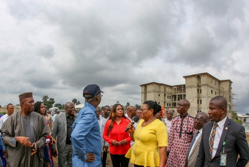 Hon Minister of Power Works  Housing Mr Babatunde Fashola SANmiddleFederal Controller of HousingTeam Leader in Akwa Ibom State ArcAqua Uzodinmaright Secretary toAkwa IbomState Government Dr Emmanuel Ekuwemleft and others during the HonMinisters inspection of theongoing construction of Storey Building2Bedroom and 3Bedroom Semi DetachedBungalowsunder the under the Federal Governments National Housing ProgrammeinIkot Ntuen Nsit  Affia Nsit Uyo Akwa Ibom State on Sunday 11th March 2018