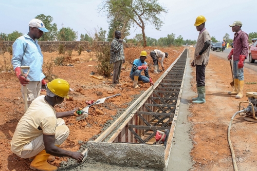 Personnel of Messrs Triacta Nigeria Limited working on drainageof the ongoing Rehabilitation of Sokoto  Tambuwal Jega Birin Yaubri SokotoKebbi States Phase I Section II  Jega  Birin Yauri Road during the inspection of the Federal Highway and other projectsin Kebbi State by theHon Minister of Power Works  Housing Mr Babatunde Fashola SAN on Tuesday 8thMay 2018