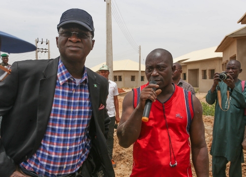 Hon Minister of Power Works  Housing Mr Babatunde Fashola SANleft interacting with Project Supervisor of one of the companies engaged for theNational Housing ProgrammeMimman Ultimate Concept Nig Ltd Mr Biliaminu Folorunshoright during the Hon Ministers inspection of the National Housing Programme and other Federal Government under the Ministry inKebbi State on Tuesday 8thMay 2018