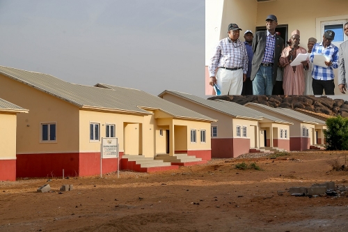 A cross section of the 2bedroom Semi Detached Bungalows of the National Housing Programme in Dutse Jigawa StateINSETHon Minister of Power Works  Housing Mr Babatunde Fashola SAN middleDirectorHighwaysConstruction and Rehabilitation Engr Yemi Oguntominiyi left and Federal Controller of Housing in Jigawa State Arc Hassan Ahmadright during the Hon Ministers inspection of the National Housing Programme site in Dutse Jigawa State on Tuesday 8thMay 2018