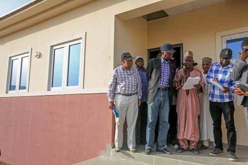 Hon Minister of Power Works  Housing Mr Babatunde Fashola SANmiddleDirectorHighwaysConstruction and Rehabilitation Engr Yemi Oguntominiyi left Federal Controller of Housing in Jigawa State Arc Hassan Ahmadrightand others during the Hon Ministers inspection of the National Housing Programme site in Jigawa State on Tuesday 8thMay 2018