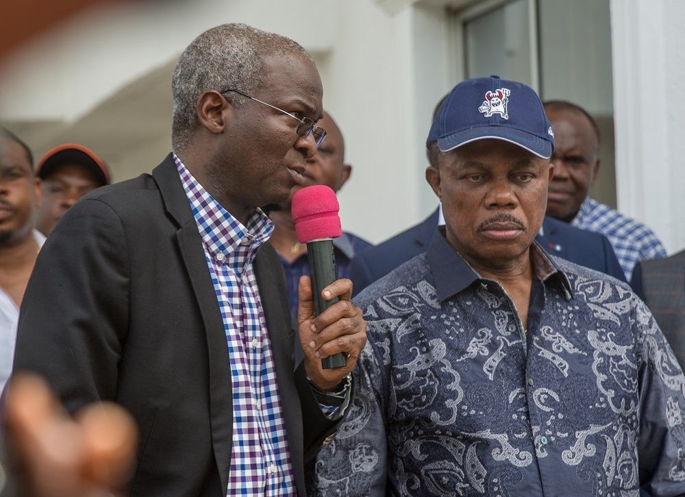 HonMinister of Power Works  Housing Mr Babatunde Fashola SANleft and Governor of Anambra StateMr Willie Obianoright speaking with journalists shortly after a courtesy visit to the Government Houseduring the Hon Ministersinspection tour of the ongoing construction work ontheMausoleum  Library Complexin Honour of Late Rt Hon Dr Nnamdi Azikiwe in Onitsha Anambra State and the 2nd Niger Bridge on Day Three of the HonMinisters inspection tour of Federal Government Infrastructure Projects in the South East Zone of the country on Thursday 19th May 2018