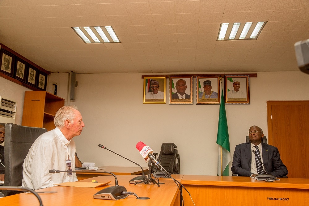 HonMinister of Power Works  Housing Mr Babatunde Fashola SAN right andformerAssistant Technical Adviser of the Super Eagles Bonfrere Joleftduringthehanding over of the keys of the Federal Government allocated House to the Coach in fulfillmentof Governments Pledge 24 years ago for Winning the 1994 African Cup of Nations at the Ministry of PowerWorks  Housing Headquarters Mabushi Abuja on Tuesday 5th June 2018