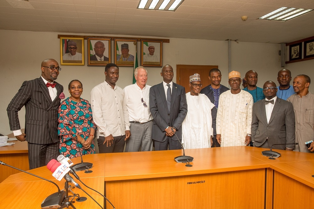 HonMinister of Power Works  Housing Mr Babatunde Fashola SAN3rd right Permanent Secretary Works  Housing Mr Mohammed Bukarmiddle Director HumanResource Mrs Morayo Alimi2nd leftformerAssistant Technical Adviser of the Super Eagles Bonfrere Jo4th left Legal Consultant to Mr Jo Mr ObasanjoLawal Esq left former Super Eagles player Benedict Akwuegbu3rd left Director Public Buildings and Housing Development Mr Dickson Onoja 3rd right and others in a group photographshortlyafter thehanding over of the keys of the Federal Government allocated House to the Coach in fulfillmentof Governments Pledge 24 years ago for Winning the 1994 African Cup of Nations at the Ministry of PowerWorks  Housing Headquarters Mabushi Abuja on Tuesday 5th June 2018