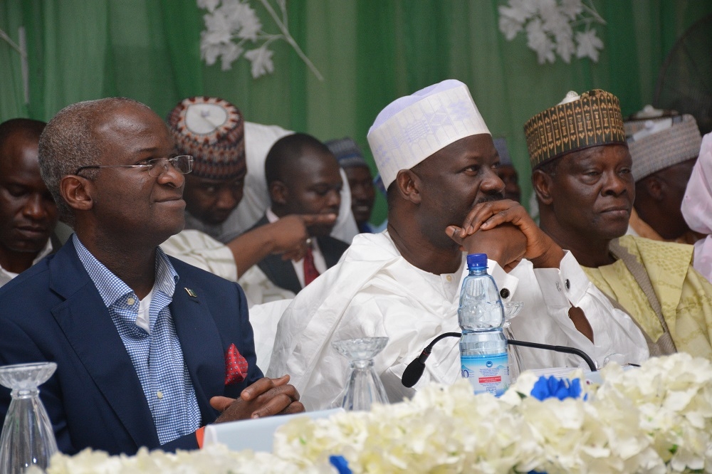 Alh Ibrahim Hassan Dankwambo Governor of Gombe State Center Minister of Power Works and Housing HM Babatunde Fashola SAN right and the Deputy Gvernor Gombe State Hon Charles Iliya