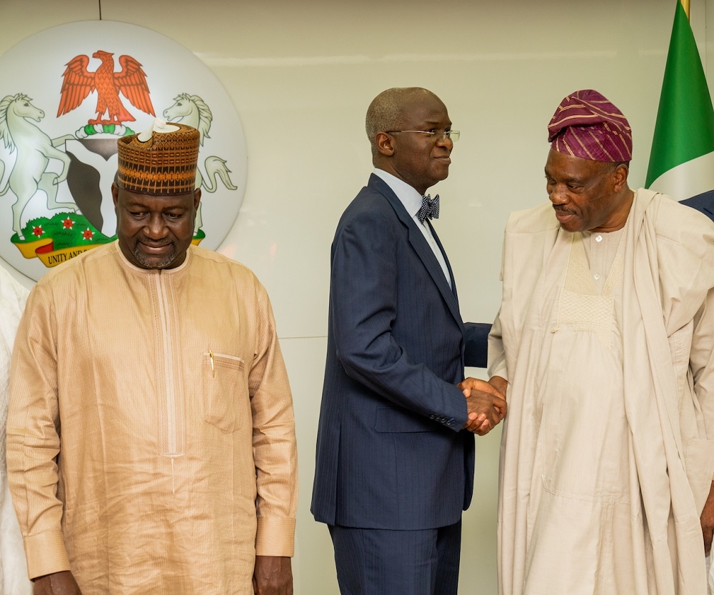 Hon  Minister of Works   Housing  Mr Babatunde Fashola SAN middle   Minister of State in the Ministry  Engr  Abubakar  Aliyu   left   and Chairman  Board of Directors of the Federal Mortgage Bank of Nigeria  FMBN   Dr  Adewale Adesoji Adeeyo  right  during a courtesy visit by the Board of Directors of the Bank at the Ministry of Works   Housing  Headquarters on Thursday  29th August 2019