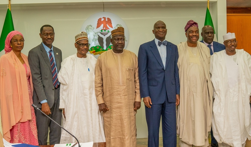 Hon  Minister of Works   Housing  Mr Babatunde Fashola  SAN  3rd right   Minister of State in the Ministry  Engr  Abubakar  Aliyu  4th left   Permanent Secretary  Works   Housing  Mr  Mohammed Bukar  3rd left   Chairman  Board of Directors of the Federal Mortgage Bank of Nigeria  Dr  Adewale Adesoji Adeeyo  2nd right    Managing Director of the Bank  Arch  Ahmed Dangiwa  2nd left  and others  in a group photograph shortly after a courtesy visit by the Board of Directors of the Federal Mortgage Bank of Nigeria  FMBN  at the Ministry of Works   Housing  Headquarters on Thursday  29th August 2019