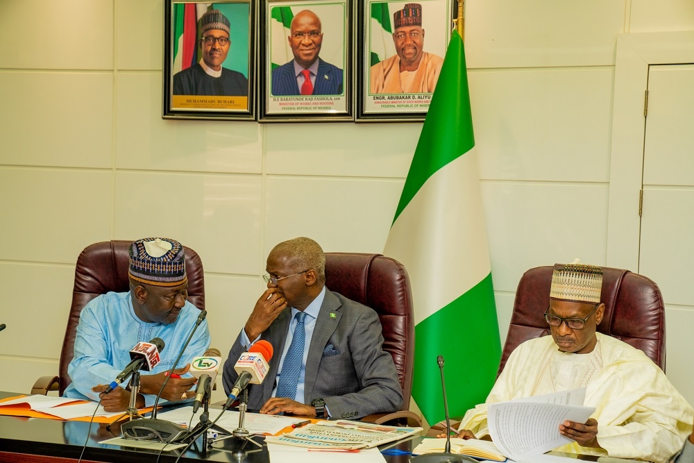 Hon  Minister of Works   Housing  Mr Babatunde Fashola SAN middle   Minister of State in the Ministry  Engr  Abubakar Aliyu  left  and  Permanent Secretary  Works   Housing  Mr  Mohammed Bukar right  during a courtesy visit by the Nigeria National Building Code Advisory Committee at the Ministry of Works   Housing  Headquarters on Thursday  3rd October 2019