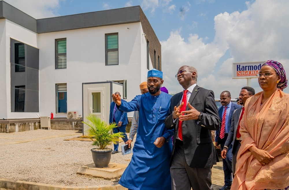 Hon  Minister of Works   Housing  Mr Babatunde Fashola SAN  left   CEO  Karmod Nigeria Limited  Mr Hakeem Shagaya right    and others shortly after  the unveiling of prefabricated assembly and installation building facility of Karmod Nigeria Limited at Plot 3075  along Kubwa Expressway  Abuja on Tuesday 15th October 2019