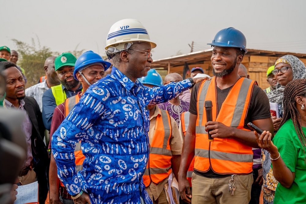 Hon  Minister of Works   Housing  Mr Babatunde Fashola  SAN  left  interacting with the Foreman on Site  Mr Obinna Onyeka  right  during the inspection of the progress of work at  the National Housing Programme Site in Delta State on Tuesday  11th February 2020