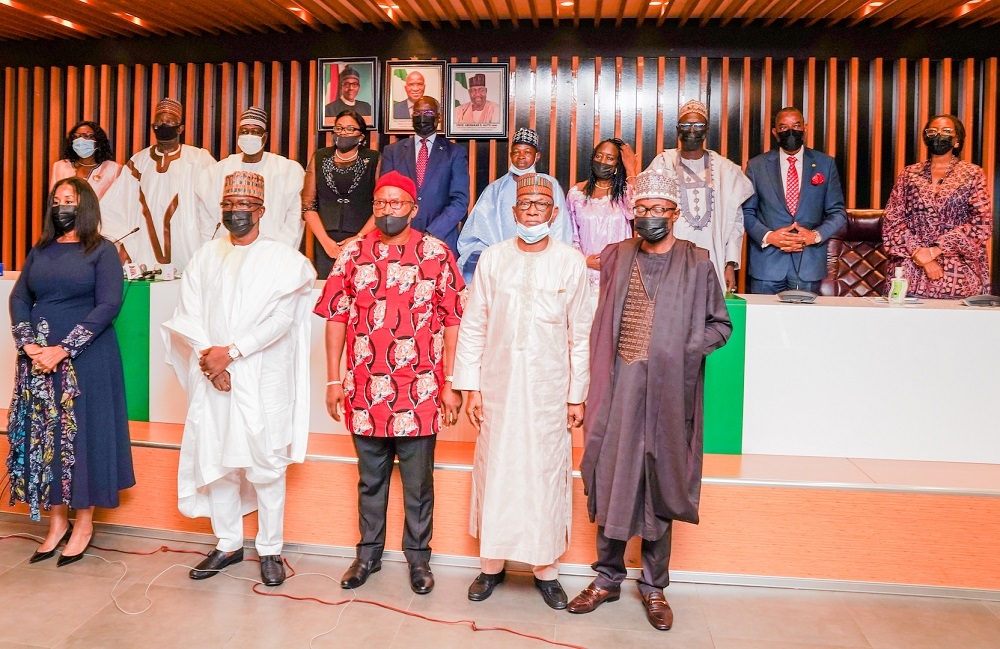 Hon. Minister of Works and Housing, Mr Babatunde Fashola,SAN(5th left; top row),Minister of State in the Ministry, Engr. Abubakar Aliyu(3rd left), Chairman, House of Representatives Committee on Housing and Habitat, Hon. Mustapha Dawaki (middle),Permanent Secretary, Mr. Babangida Hussaini(3rd right),Chairman, Board of the Federal Housing Authority(FHA), Senator Lawal Shuaibu(2nd left), Managing Director/CEO, Federal Housing Authority(FHA), Senator Gbenga Ashafa(2nd right),  and other members of the Board  in a group photograph shortly after the Inauguration of the Board of Directors of the Federal Housing Authority(FHA) at the Ministry of Works and Housing Headquarters, Mabushi, Abuja on Thursday 8th July 2021. 