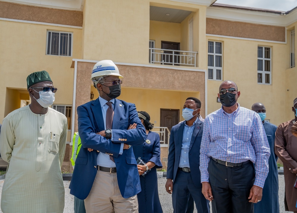 Hon. Minister of Works and Housing, Mr Babatunde Fashola, SAN (middle), Permanent Secretary of the Ministry, Mr. Babangida Hussaini(left) and Managing Director/CEO, Federal Housing Authority(FHA), Senator Gbenga Ashafa(right) during an inspection tour of the 764-Units Federal Housing Authority Residential Layouts (Abuja Mass Housing Scheme )  in Zuba, Abuja, FCT on Tuesday, 31st  August 2021. 