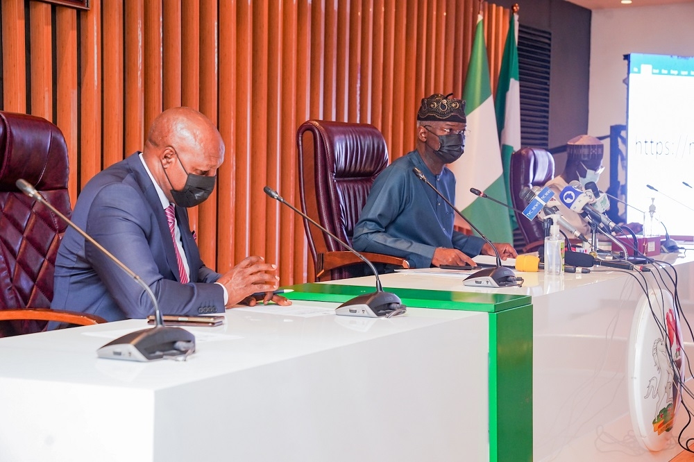 Hon. Minister of Works and Housing, Mr Babatunde Fashola, SAN (middle), Permanent Secretary in the Ministry of Works and Housing, Mr. Babangida Hussaini (right) and President, Nigerian Guild of Editors, Mr Mustapha Isah (left) during the launching of the Web Portal for sale of the National Housing Programme (NHP) completed homes to Nigerians at the Ministry of Works and Housing, Headquarters, Mabushi, Abuja on Friday, 12th November 2021. 