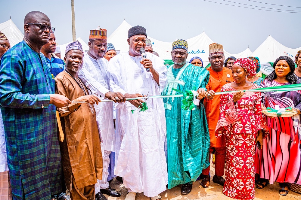 Representative of President Muhammadu Buhari and Senior Special Assistant, Council Services, FCTA, Hon. Muhammad Saba (middle), Senator reprepresenting Kogi East Senatorial District, Senator Isah Jibrin (2nd right), representative of the Hon.Minister of Works and Housing &amp; Director/HOD Public Building and Housing Development, Arc. Solomon Labafillo (2nd left), Federal Controller of Housing, Kogi State, Arc. Hajara Enesi (right) and others at the commissioning of Homes completed under the National Housing Programme (NHP) Phase I located off Lokoja - Okene Highway, Lokoja, Kogi State on Monday, 14th March 2022.