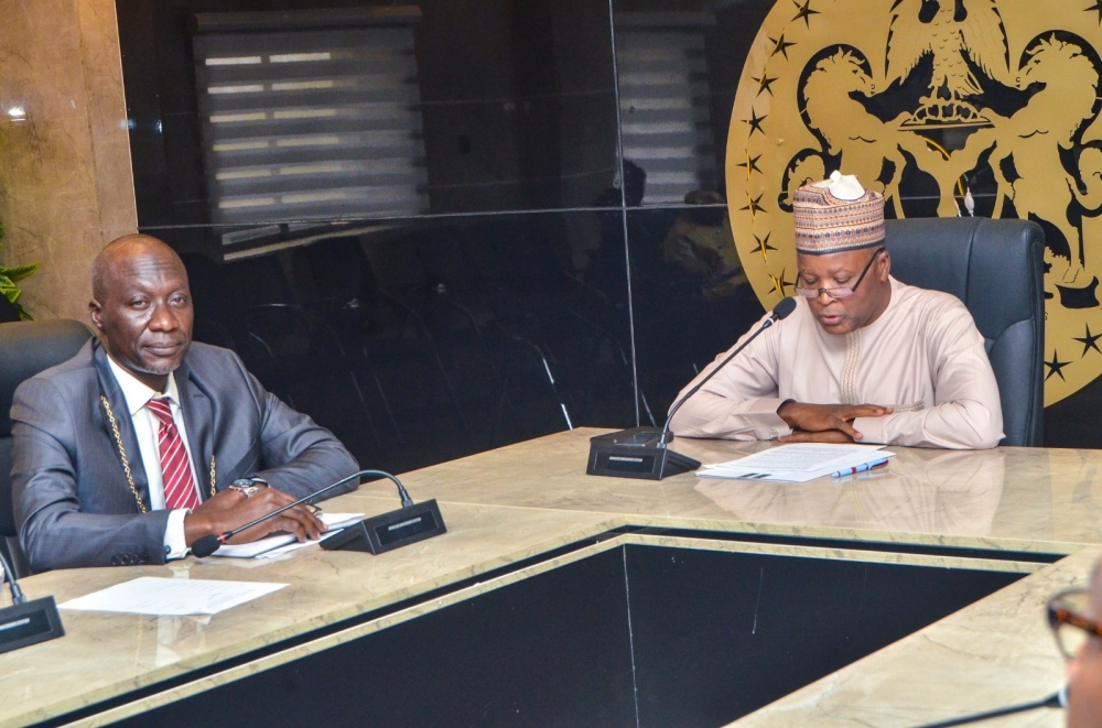 Hon. Minister of State Housing and Urban Development, Abdullahi Tijjani Gwarzo; receiving President, Nigeria Institute of Brokers and Lender; QS, Hayatuddeen  Auwal with members of his Delegations during a courtesy visits to the Ministry.