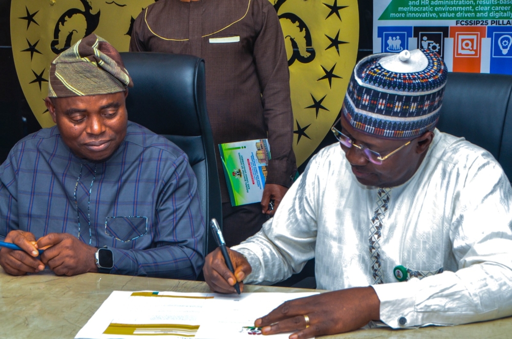 The Permanent Secretary,  Federal Ministry of Housing and Urban Development,  Dr. Marcus O. Ogunbiyi with Directors / Head of Units at the signing of the Performance Management Contract at the Ministry's Headquarter, Mabushi, Abuja on the 4th of July, 2024