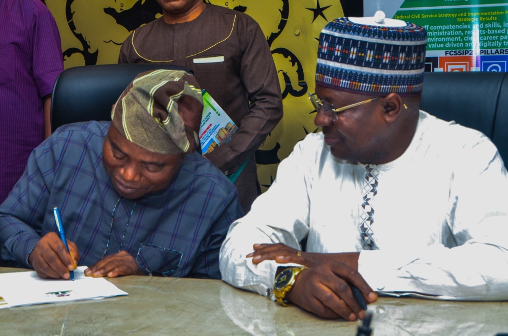 The Permanent Secretary,  Federal Ministry of Housing and Urban Development,  Dr. Marcus O. Ogunbiyi with Directors / Head of Units at the signing of the Performance Management Contract at the Ministry's Headquarter, Mabushi, Abuja on the 4th of July, 2024