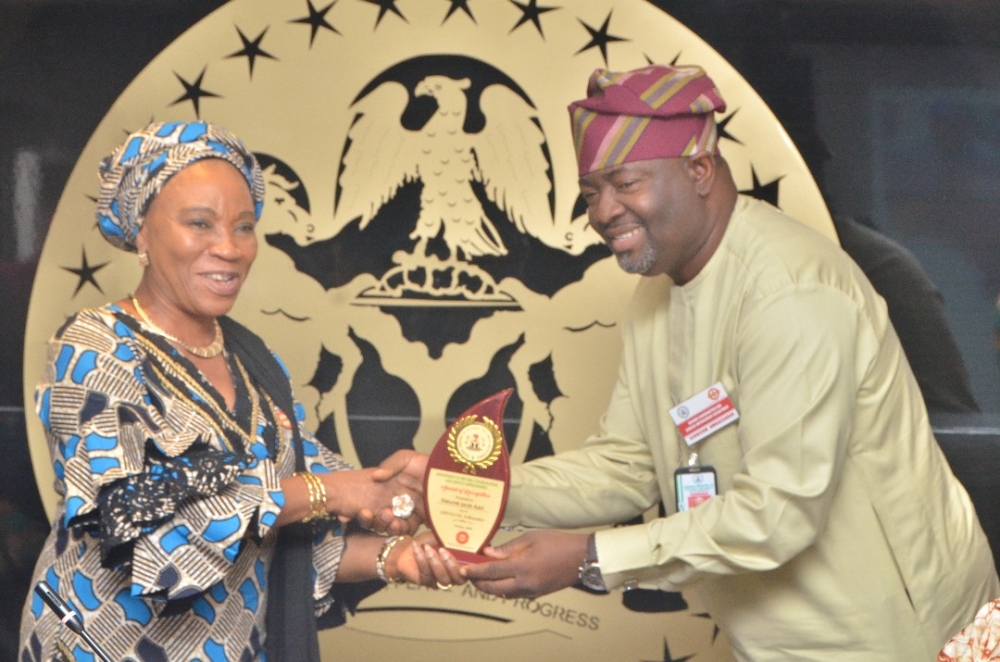 Presentation of award by the Hon Minister Arch. Ahmed Dangiwa, the Permanent Secretary Dr. Marcus Ogunbiyi and the National Servicom Coordinator at the Presidency to some Directors and  management staff of the Ministry in celebration of the 2024 Servicom Service Week at the Ministry's Conference Room, Mabushi, Abuja on the 7th October, 2024.