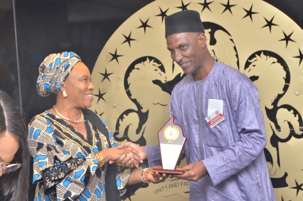 Presentation of award by the Hon Minister Arch. Ahmed Dangiwa, the Permanent Secretary Dr. Marcus Ogunbiyi and the National Servicom Coordinator at the Presidency to some Directors and  management staff of the Ministry in celebration of the 2024 Servicom Service Week at the Ministry's Conference Room, Mabushi, Abuja on the 7th October, 2024.