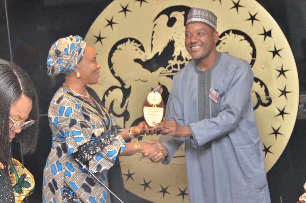 Presentation of award by the Hon Minister Arch. Ahmed Dangiwa, the Permanent Secretary Dr. Marcus Ogunbiyi and the National Servicom Coordinator at the Presidency to some Directors and  management staff of the Ministry in celebration of the 2024 Servicom Service Week at the Ministry's Conference Room, Mabushi, Abuja on the 7th October, 2024.